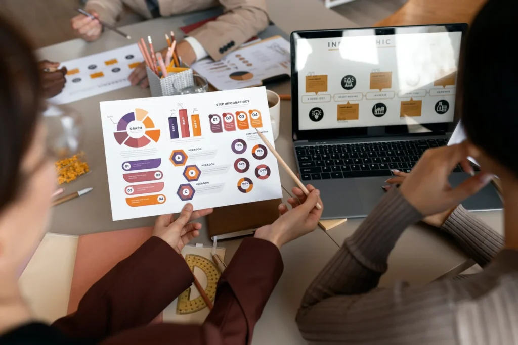 high angle people working with laptop